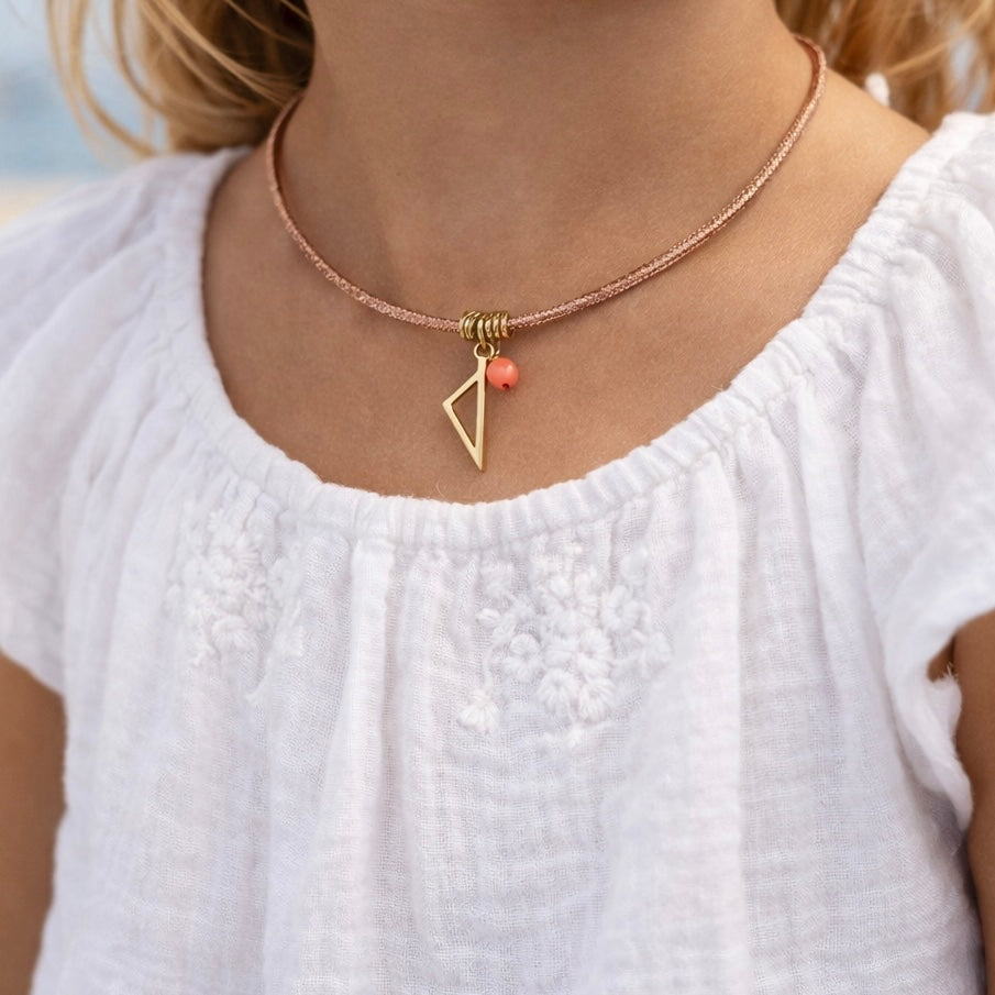 Collier enfant Isula en cordon rose avec pendentif Corse en acier inoxydable doré et tube de Corail rouge de Méditerranée