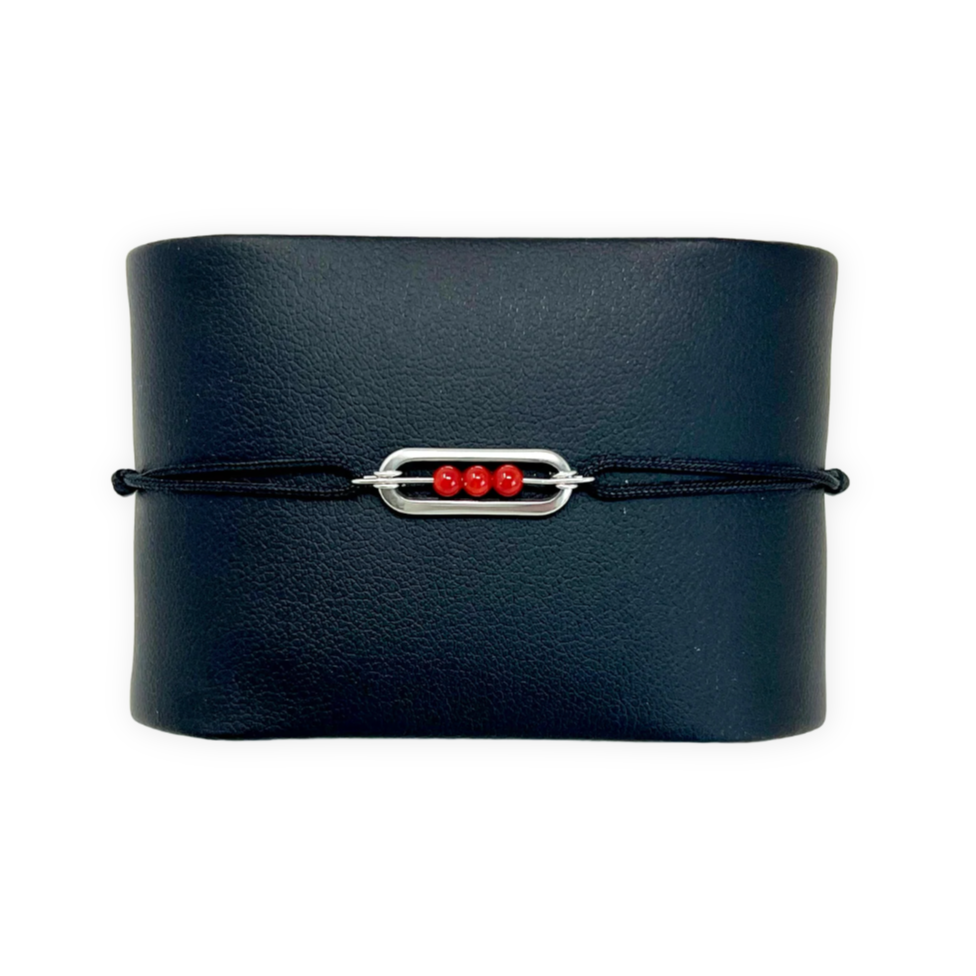 Bracelet enfant en cordon noir avec élément central en acier inoxydable et perles de Corail rouge de Méditerranée