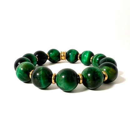 Le bracelet Hope allie élégance et énergie positive, conçu pour vous accompagner avec style et sérénité. Composé de grosses perles d’Œil de Tigre vert, reconnues pour leurs propriétés protectrices, et de rondelles en acier inoxydable, ce bijou intemporel symbolise bonheur et chance.